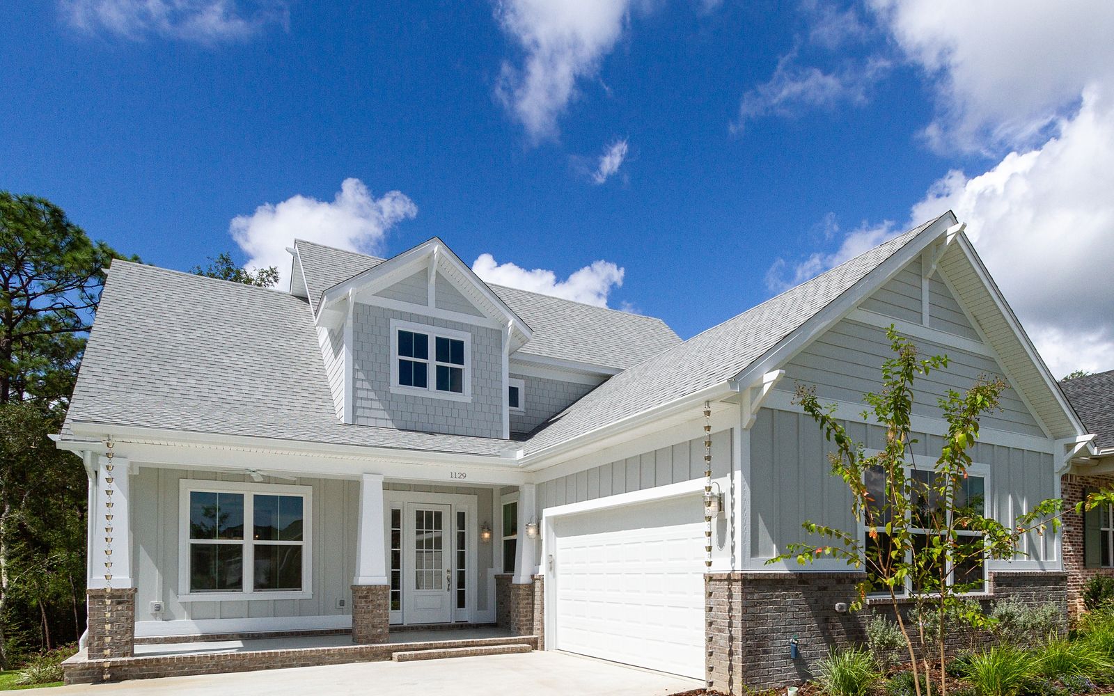 Gray Craftsman home with attached garage, Northwest Florida